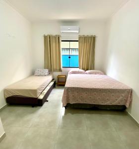 Casa da Cle, 2 quartos, ar condicionado, 600m da praia