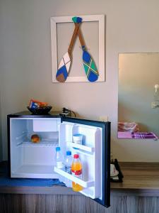 Quarto tranquilo c frigobar a 5 min do aeroporto