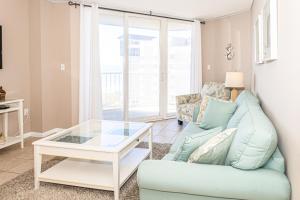 Ocean-view condo with outdoor pool, balcony, WD, AC, sauna & gym