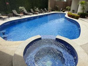 Monaco Condominiums Luxury Pool View Condo 3BR 2BA - Walk to the Beach, Shopping, Tours