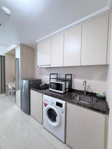 Green Sedayu Apartment Suite Garden View by Ellison