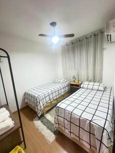 Apartamento de dois quartos para até quatro pessoas com 01 vaga privativa