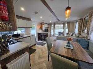 Nestled beneath the trees is this beauty a 3 bed property with hot tub and stunning views