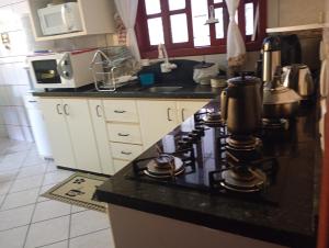 Casa 4 Quartos garagem 3 carros, churrasqueira e ar condicionado,