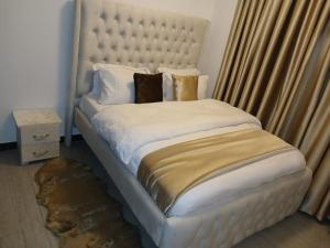 Beautifully furnished two bedroom with scenic city views , swimming pool, equipped gym ample parking and child playground