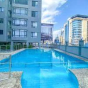 classy executive two bedroom apartment with fully equipped gym ample parking space , swimming pool children playing ground and amazing scenic views