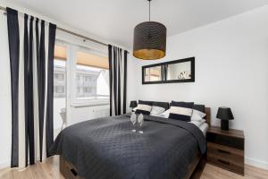 Przytulne Apartamenty z Balkonem w Centrum Blisko Plaży by Noclegi Renters