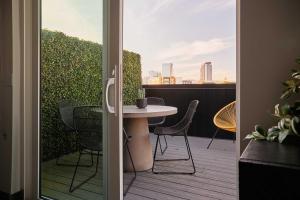 SoBro Studio with Patio City Views Rooftop + Gym Walk to Broadway Stylish Unit Community Amenities Paid Garage Parking 24 7 Hospitality