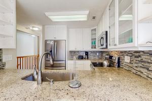 Waterfront duplex with private outdoor pool, enclosed yard, gazebo, sound views