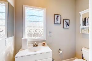 Dog-friendly, water-view home with scenic balcony, grill, washerdryer & AC