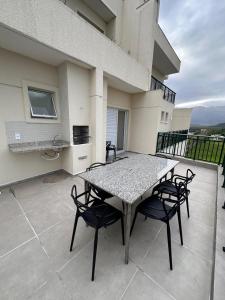 Apartamento em Bertioga com churrasqueira