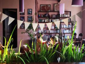 Here Library - The entire riverside wooden home with the library