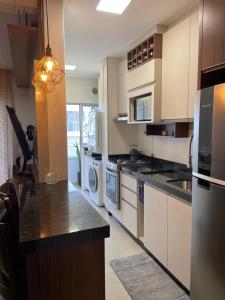 Apartamento com 2 vagas de garagem, próximo a roda gigante