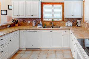 Waterfront home with private pool, hot tub, pool table & theater- near the beach