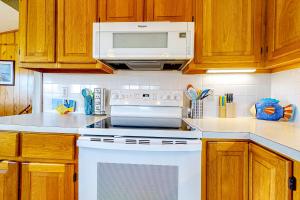 Charming water view home with pool access, decks & outdoor shower - dog-friendly