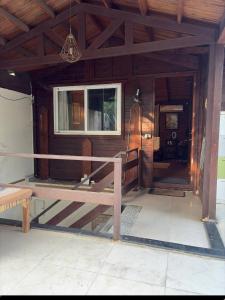 Green Verandah And The Wooden House
