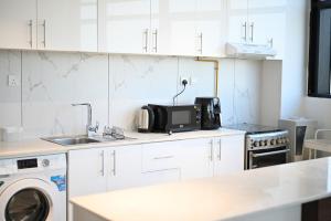 Quickstay holiday homes spacious and bright Balcony Breeze 01 bhk O2 Tower