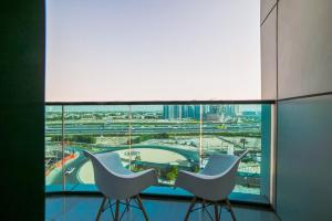 Quickstay holiday homes spacious and bright Balcony Breeze 01 bhk O2 Tower