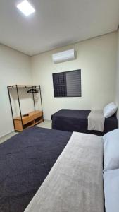 Casa com Piscina a 100 metros da praia Ilha Comprida