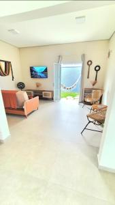 Casa com Piscina a 100 metros da praia Ilha Comprida