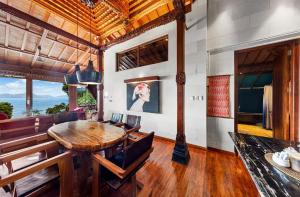 Located on a hill with astounding panoramic mountain and sea views !!