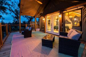 Secluded Treehouse Tent Retreat on the Marsh with Outdoor Dining, Grilling Gear, Games, Views in Townsend, Georgia