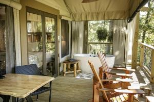 Luxury Family Tree Tent with Private Deck, Soaking Tub & Pizza Oven Near Waterfalls, Zirconia, North Carolina