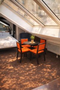 L’Écrin Sous les Toits – Coeur de Paris