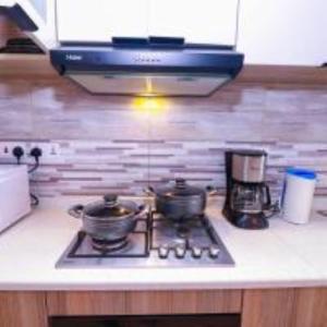 serenity heights two bedroom apartment with heated swimming pool fully equipped gym ample parking space child play area and amazing scenic views