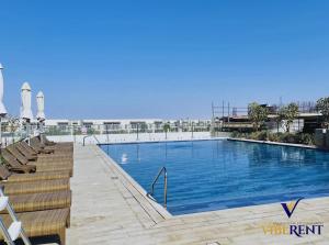 Modern 1BR in Damac Hills 2, Pool & Desert views
