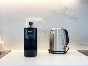 Sunlit Retreat in Voula Center