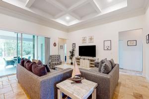 Dog-friendly home with Tesla EV charger, yard, patio, grill, AC, & WD