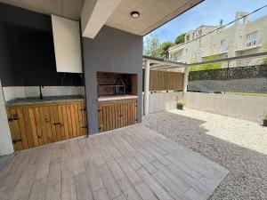 Departamento Duplex con patio, parrilla y garaje