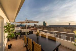 Bright Beachside Flat with Terrace by HostWise