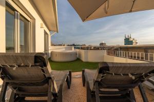 Bright Beachside Flat with Terrace by HostWise