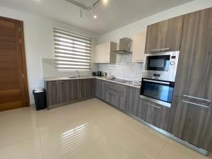 Beachfront 9ten11 Maisonette w Terrace by Homely
