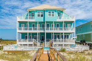 Completely renovated oceanfront home with shared outdoor pool views & balcony