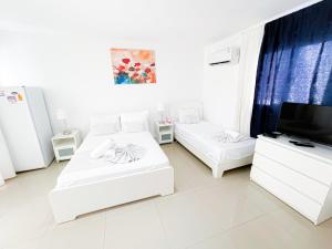 TROPICANA DELUXE Suites and Studios APART HOTEL BEACH Club & SPA