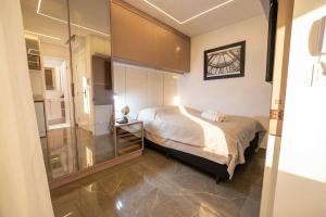 Batel Vista Luxury | Ar condicionado, Varanda e +