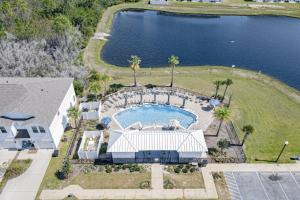 Inviting townhouse with golf nearby pool central AC W&D working desk & chair