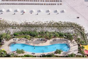 Charming Gulf-front condo with pools gym & beach access - near restaurants