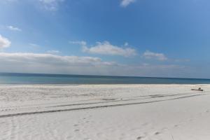 Bright waterfront condo in a gated resort with pools tennis courts & gym