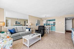 Ground floor oceanfront beachy condo with furnished patio outdoor pool gym