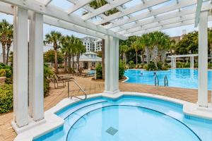 Bright & cozy coastal condo with shared pools hot tubs fast WiFi & central AC