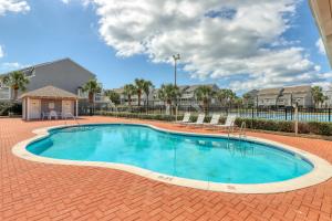 Dog-friendly townhome in private community with pool - near beach
