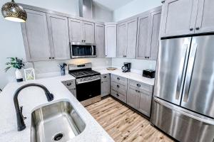 Dog-friendly home with two full kitchens balcony AC washers & dryers