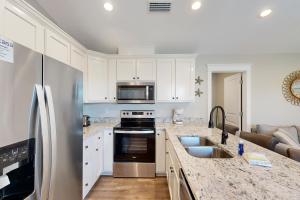 Inviting home near the beach with balcony full kitchen central AC & W&D