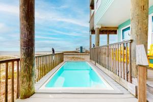 Three story beachfront home with private pool porch and boardwalk to gulf coast