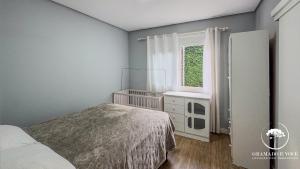 Casa com piscina 3 suítes a 15 min Centro Gramado