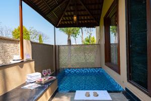 ELIVAAS Signature Tiger Cave Suite with Pvt and Shared Pool On Main Ranthambore Rd